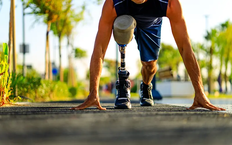 man running with prosthetic leg