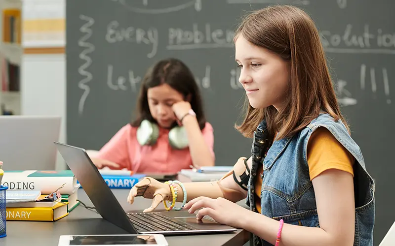 girl in school with prosthetic arm